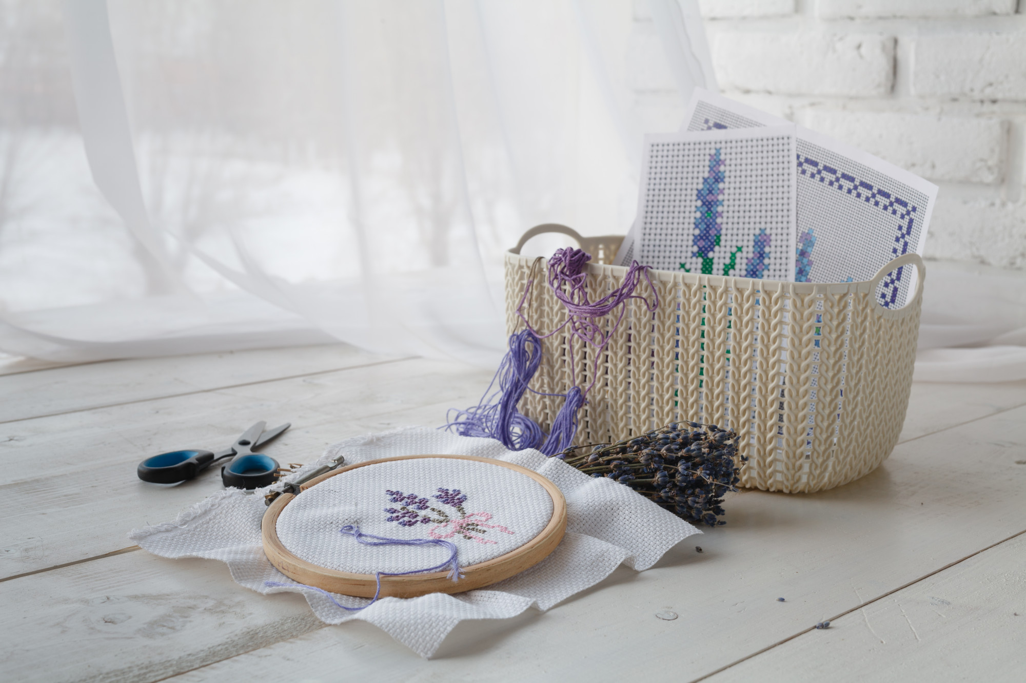 Three sample embroidered items on table